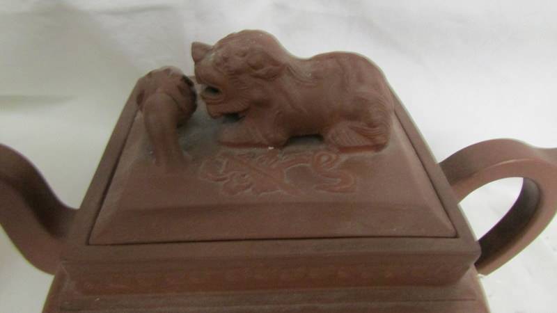 A Chinese earthenware teapot with dog of foo knob to lid. A/F - Image 2 of 12