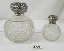 2 silver topped perfume bottles, 1 dated 1906, marked D. L. for David Loebl, London & the other