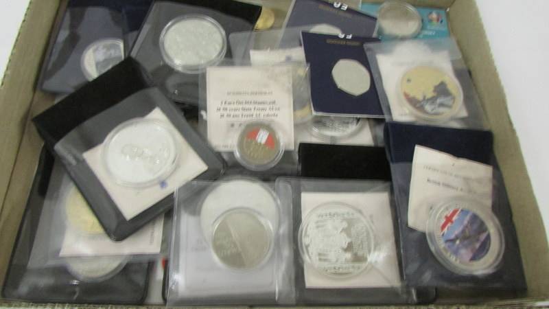 A quantity of collector's coins including at least one 999 silver coin.