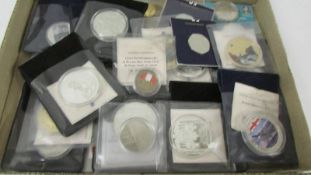 A quantity of collector's coins including at least one 999 silver coin.