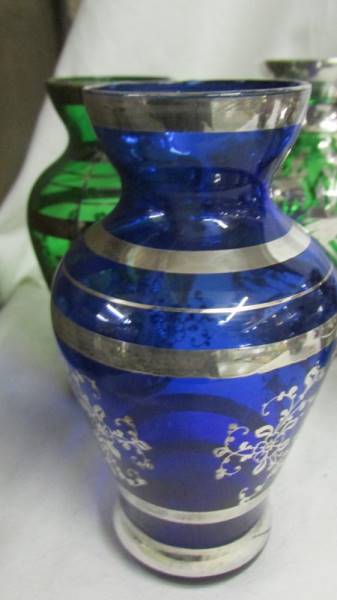 Five coloured glass vases decorated with silver and a blue glass decanter with 6 glasses also - Image 5 of 7