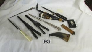 A mixed lot including old pipe, match box holder, glove stretchers, letter opener etc.,