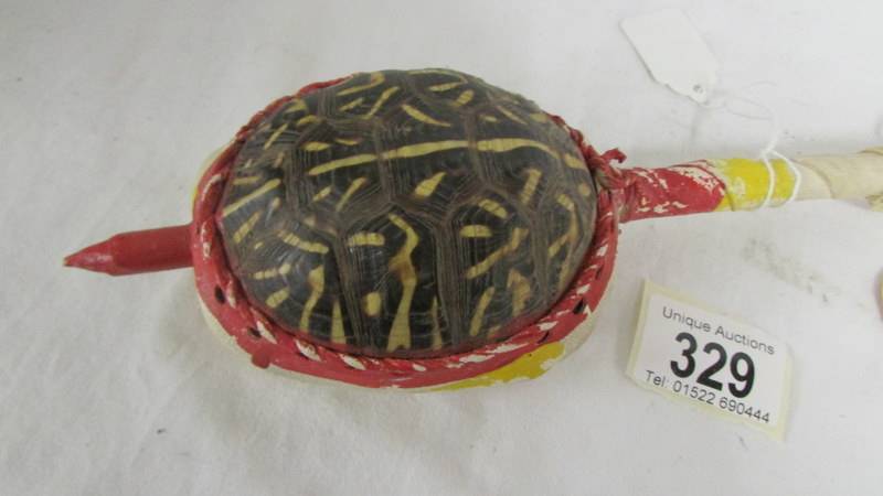 A vintage Indian made tortoise shell rattle instrument. - Image 2 of 4