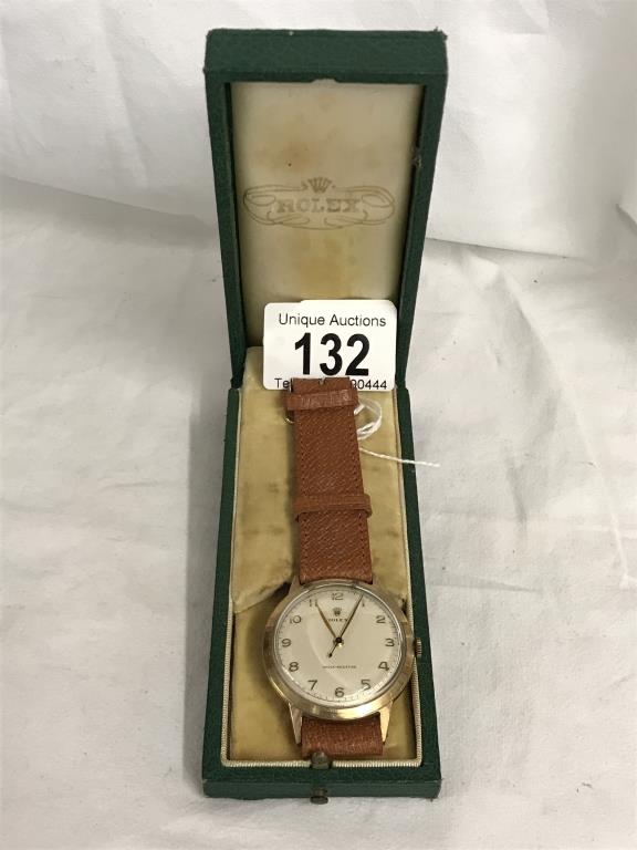 A 9ct gold gent's Rolex wrist watch, marked ALD421309, 13874 Dennison, Made in England for Rolex.
