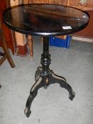 A French ormolu mounted tripod table.