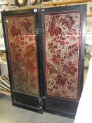 A pair of wood framed ruby overlaid glass doors.