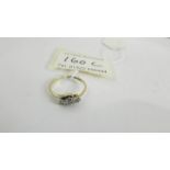 An 18ct gold and diamond ring, size O half.