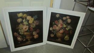 A pair of white framed floral oil paintings on canvas. Collect only.