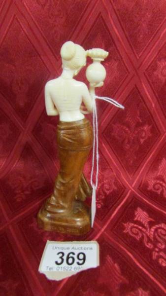 An antique carved ivory and wood female figure. Available for UK shipping only. - Image 3 of 3