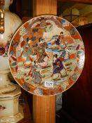 A handpainted oriental charger,