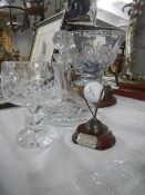 A large cut glass golf trophy bowl on stand, another golf trophy, a decanter and a goblet. Collect