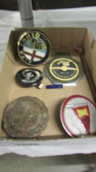 A quantity of car badges, brass radiator cap etc.,
