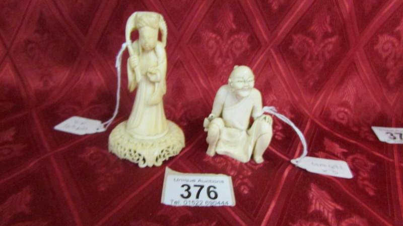 Two antique carved ivory figures. Available for UK shipping only.