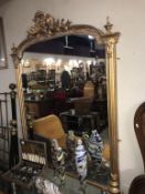 A large ornate gilt framed mirror