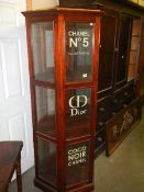 A hexagonal shop display cabiner signwritten for Chanel No.5 - CD Dior & Coco Noir Chanel, with key.