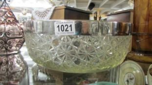 A large heavy glass bowl with plated rim. Collect only.