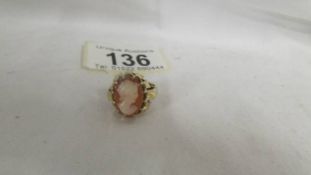 A cameo ring set female profile in textured and fancy 9ct gold mount, size J half.