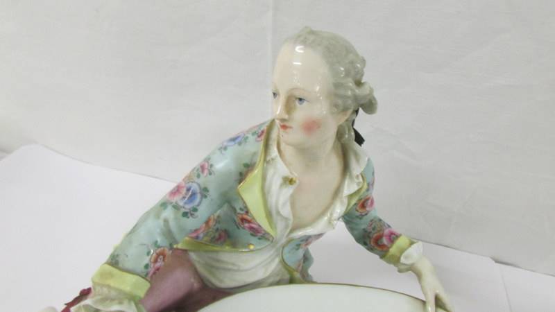 A pair of fine porcelain male and female figure/sweet meat dishes with crossed swords mark. - Image 8 of 9