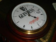 A Guinness wall clock.