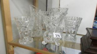 A quantity of cut glass vases and a jug. Collect only.