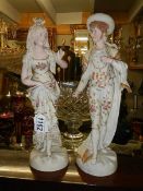 A good pair of continental porcelain figures, 34 cm tall.