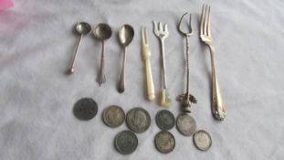 Five items of silver flatware including pickle forks, salt spoons etc., 33 grams. 13 grams of silver