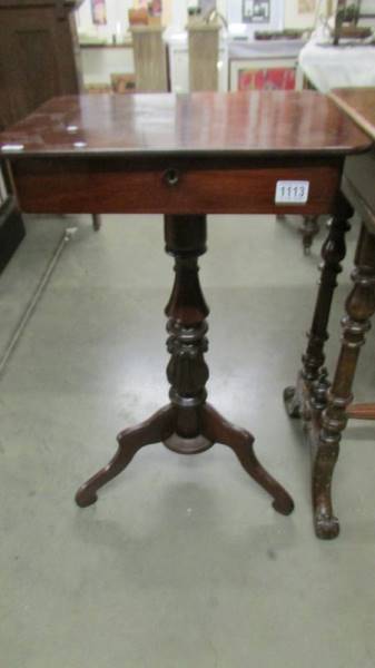 A Victorian work table with drawer.