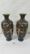 A pair of Japanese cloissonne vases.