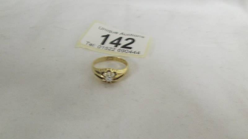 An early 20th century diamond single stone ring in 18ct gold size J half. Weight 3gms