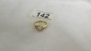 An early 20th century diamond single stone ring in 18ct gold size J half. Weight 3gms