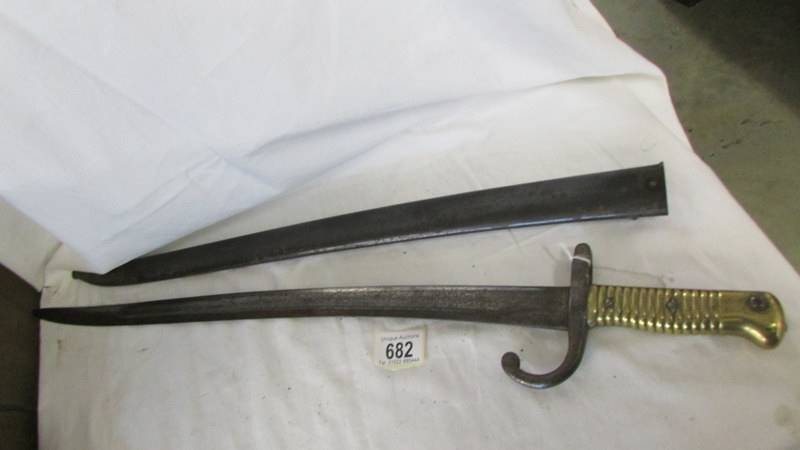 An old bayonet in sheath.