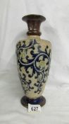 An 11.5" high Doulton vase by George Tinworth.