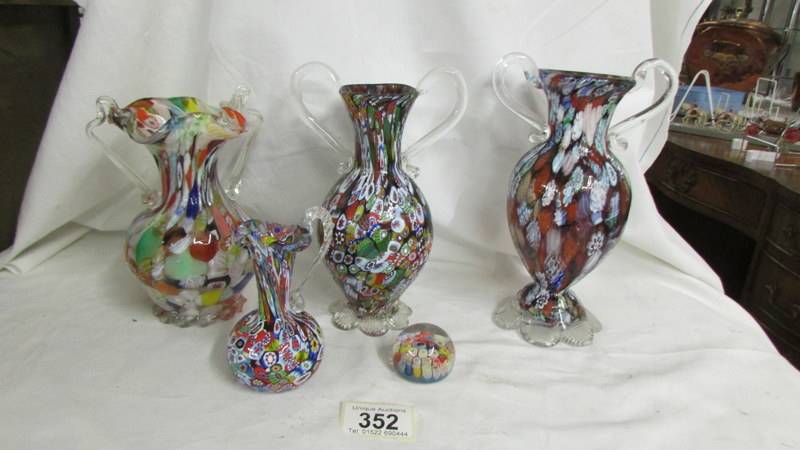 Three millifiori glass vases, a millifiori glass jug and a small millifiori paperweight.