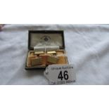 A cased pair of 9ct gold cuff links, 4.8 grams.