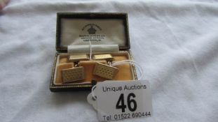 A cased pair of 9ct gold cuff links, 4.8 grams.