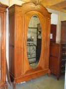 A good French single mirrored door armoire.