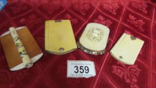 Two antique ivory note pads, an antique ivory purse and an antique ivory comb.