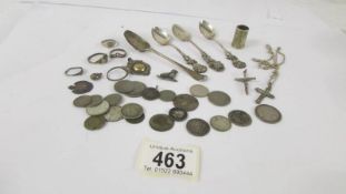 A mixed lot of mainly silver spoons, rings, coins etc.,