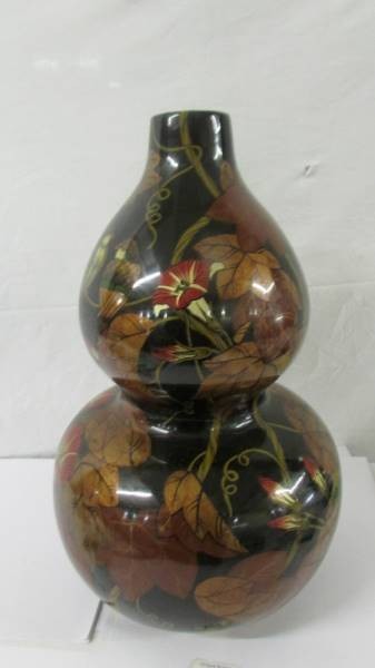 An unusual double gourd base decorated with birds and flowers, possibly of Chinese origin.