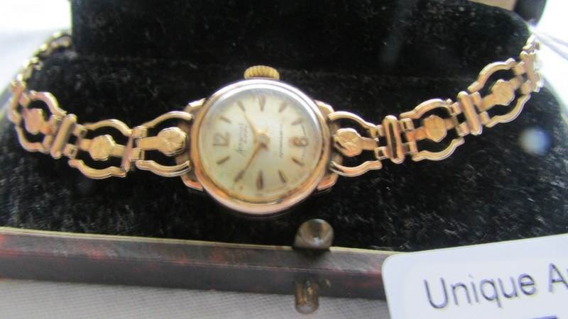 An Accurist gold ladies wrist watch. Bracelet hallmarked, case hallmarked, watch is wound to it's - Image 2 of 2