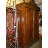 A large two door French armoire with paneled doors. (Width 148cm , depth 52cm, height 240cm.)