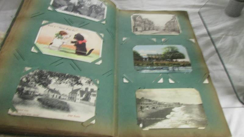 An album of approximately 250 old postcards. - Image 6 of 15