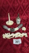 Three items of antique carved ivory, an antique metal and ivory dragon and a scent bottle.