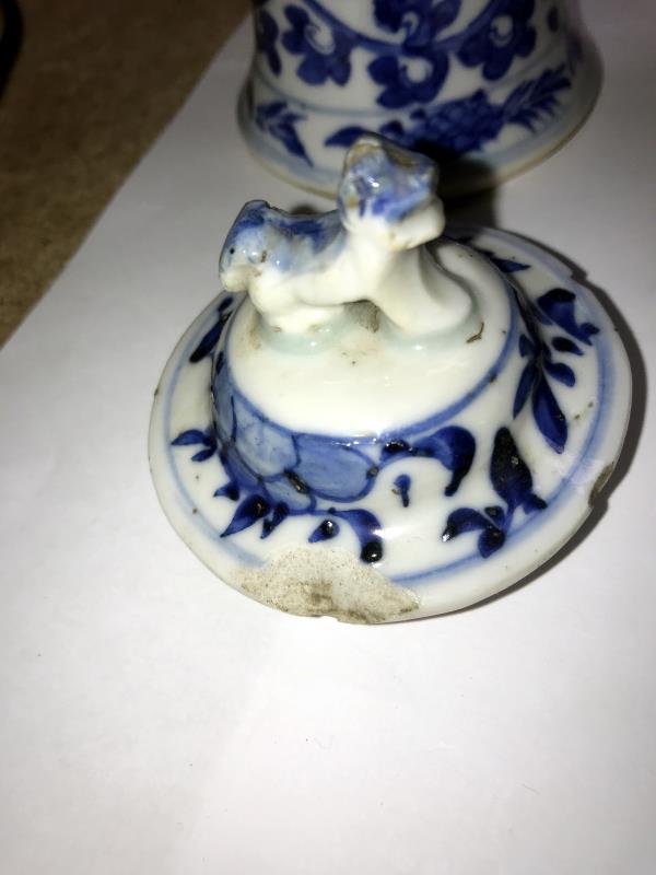 A pair of early Chinese blue and white lidded vases (both lids a/f) and a blue and white flask. - Image 24 of 25