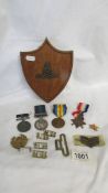 A mixed lot of medals and badges including WW1.
