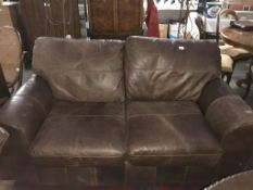 A new two seater soft brown leather sofa. (Collect only)