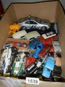 A quantity of unboxed Corgi, Hot Wheels, Burago and tin plate model cars.