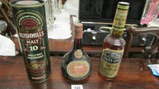 A bottle of Para 1947 vintage port, a bottle of James Cook rum and a bottle of Bushmills 10yr malt