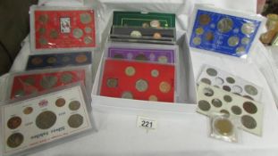 A selection of UK coin sets including 1966 world cup, the coinage of George V, 1965 Churchill etc.,