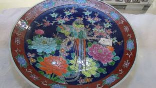 A Japanese hand painted plate, 38 cm diameter. Collect only.